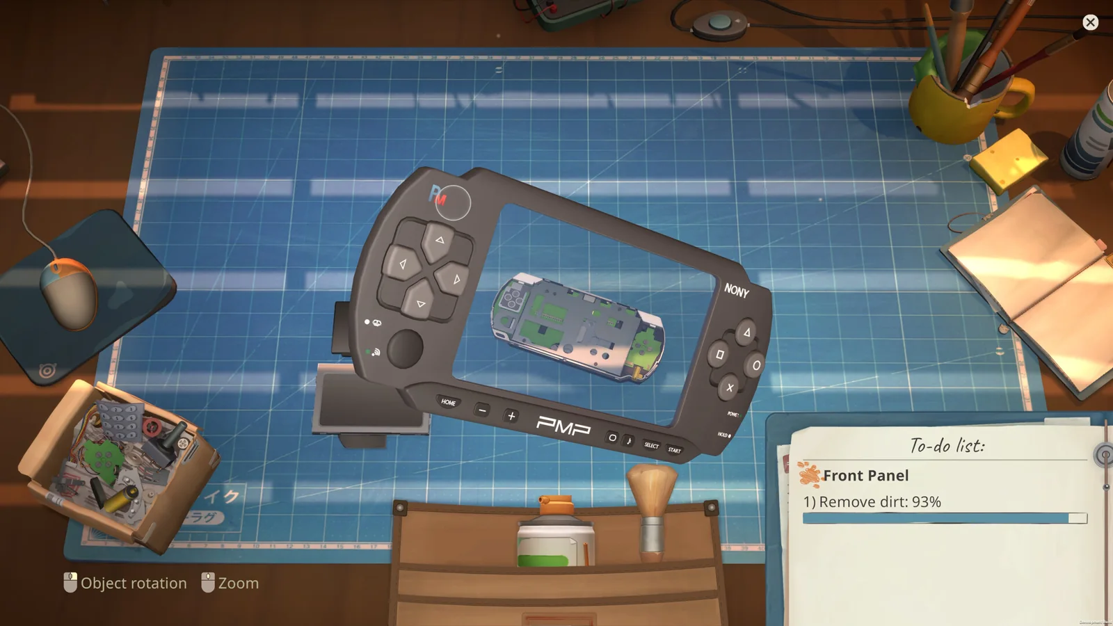 Disassembled handheld console on a ReStory repair workbench